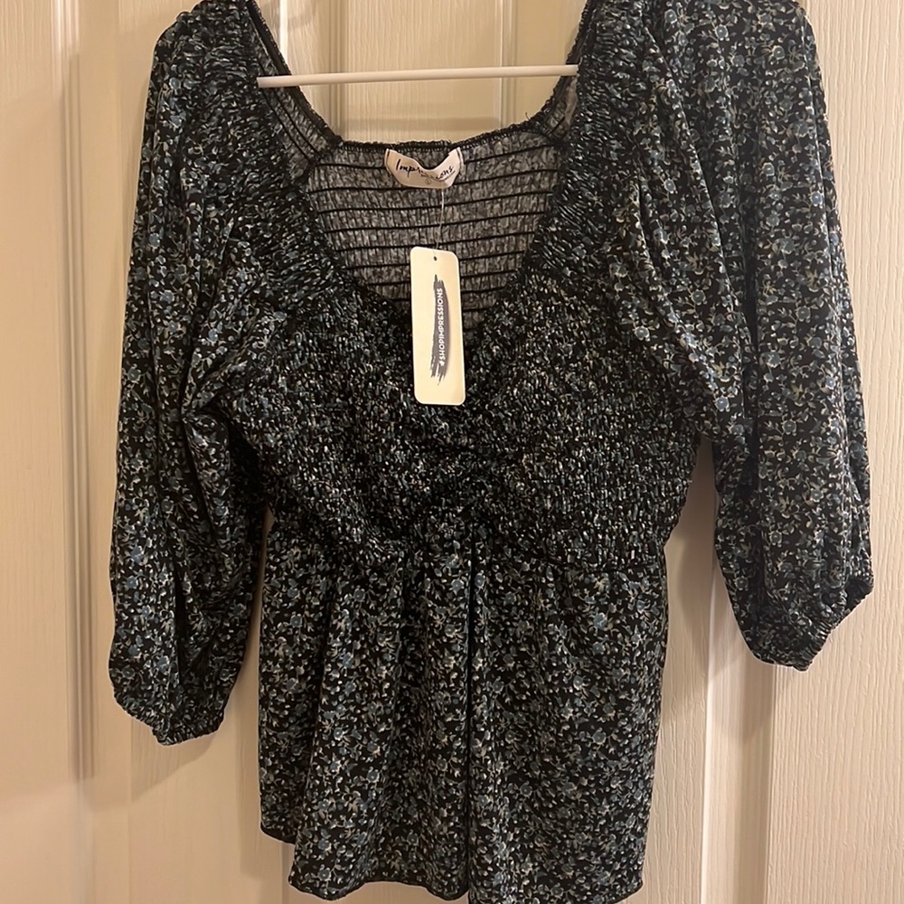 Babydoll top. NWT. Impressions. Floral pattern, size large.